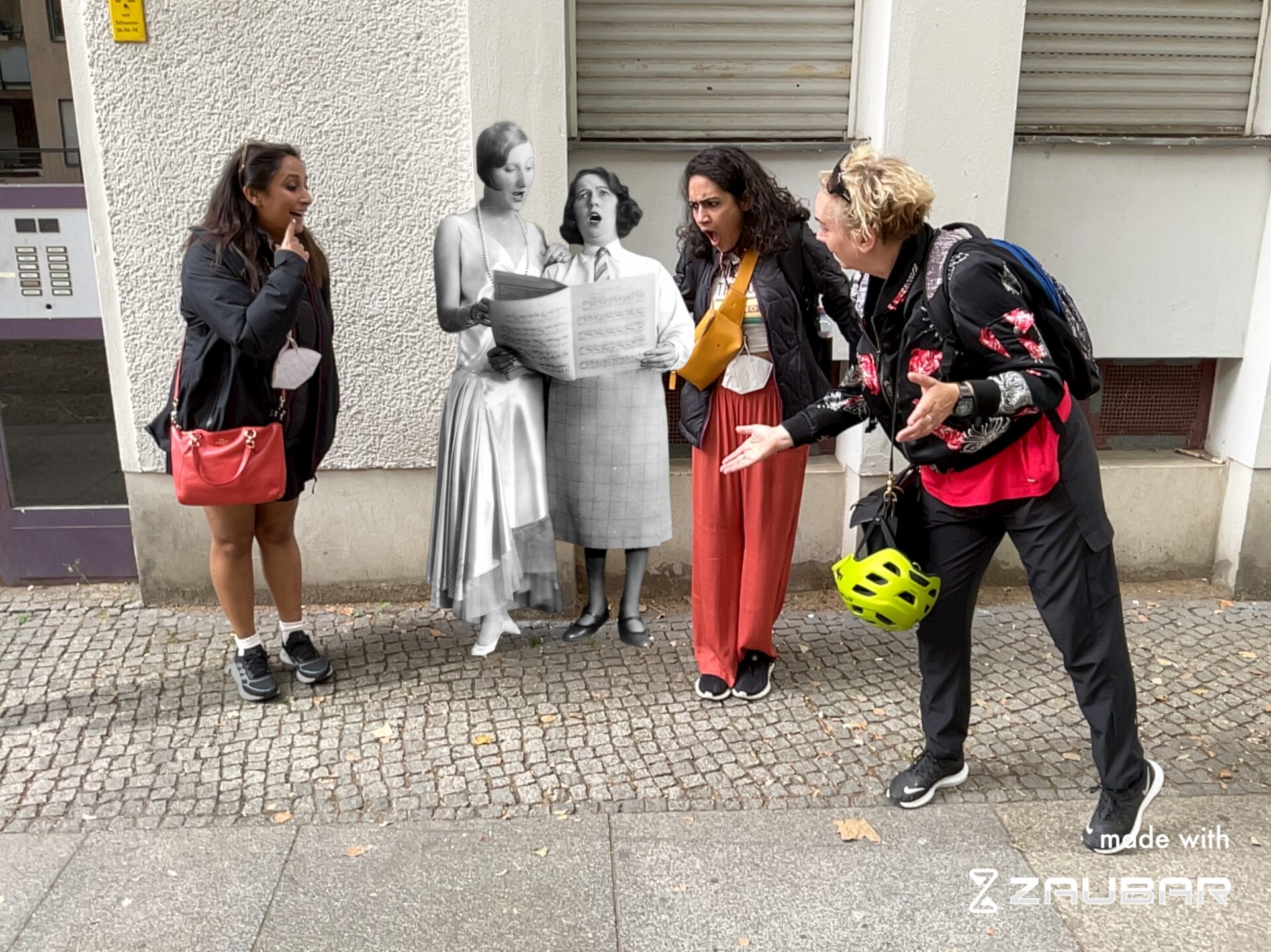 Three people standing around Claire Waldoff in Augmented Reality